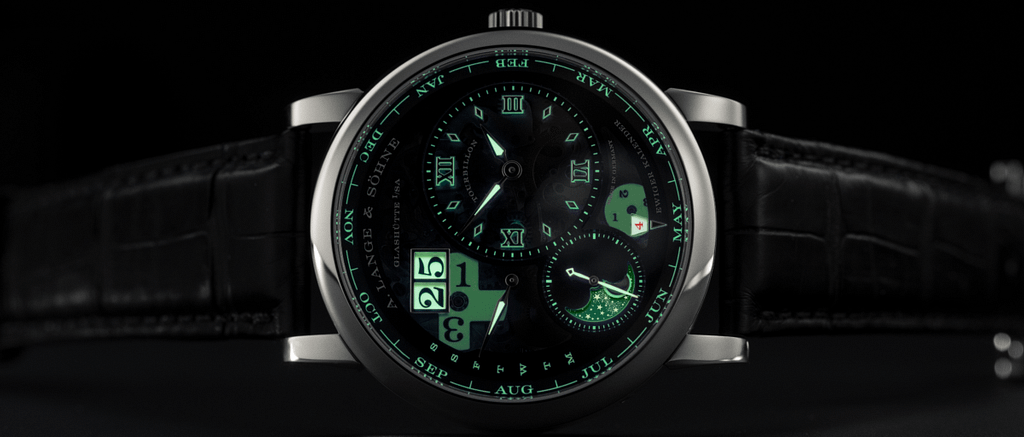 A. Lange & Sohne Lange 1 Tourbillon Perpetual Calendar watch glowing in the dark.