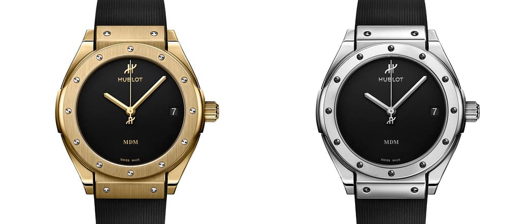Yellow gold and white gold Hublot Classic Fusion Tributo watches on black rubber straps.