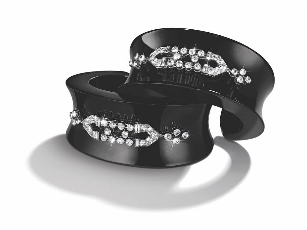 Belperron black jade cuff bracelets with diamond art deco style accents.