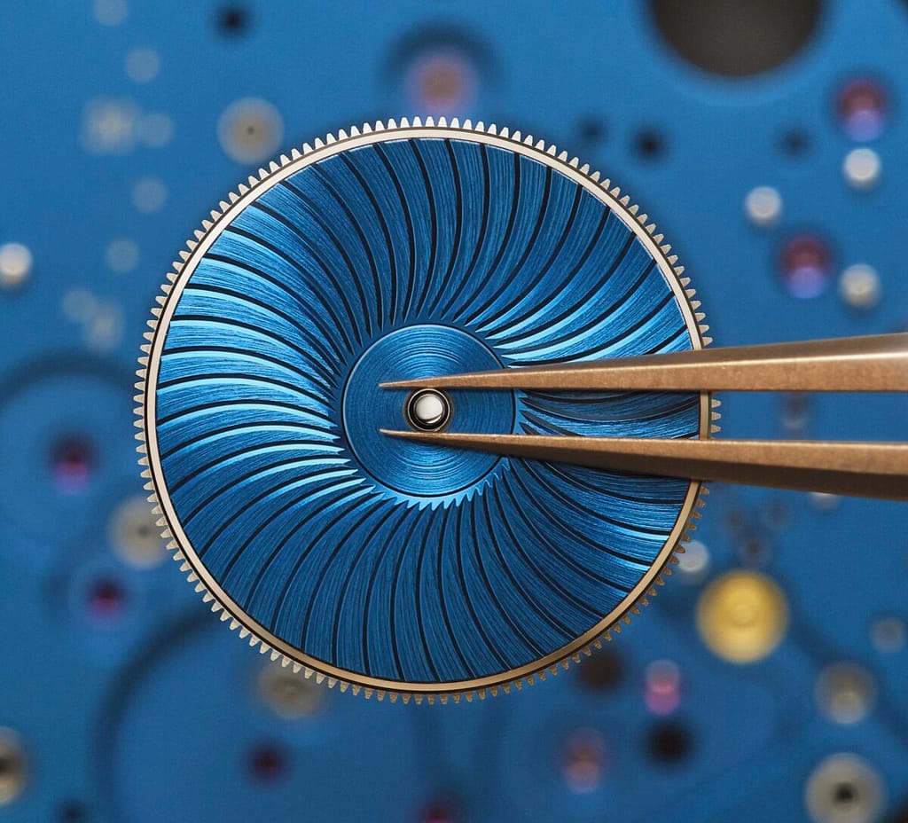 fitting the blue guilloche barrel cover on the new new Breguet Tradition Seconde Rétrograde 7037 watch