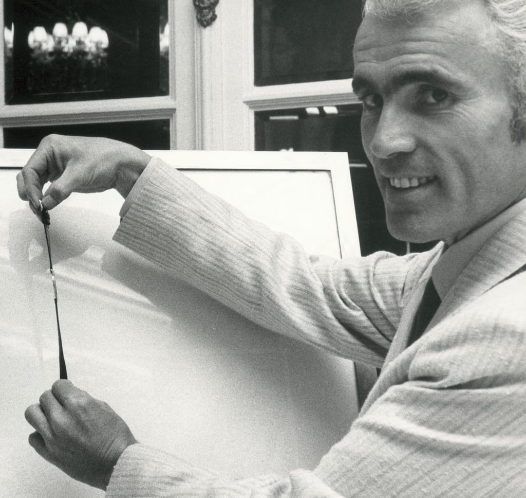 Yves Piaget holding a Piaget watch