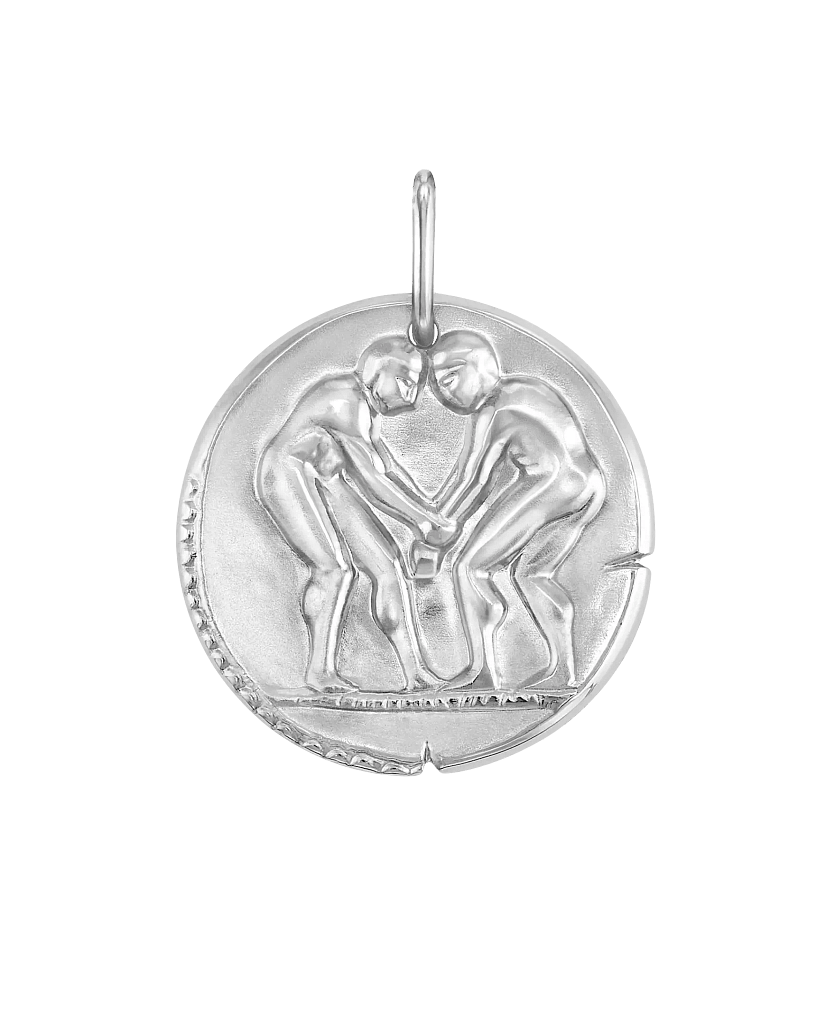 Van Cleef & Arpels Gemini zodiac medal pendant in carved relief white gold.